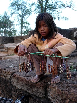 Child  selling bracelets