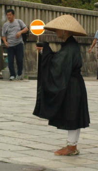 Monk guy begging