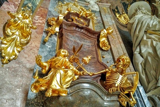 Golden skeleton (Death) is about to snip the thread this Cherub is holding with scisors