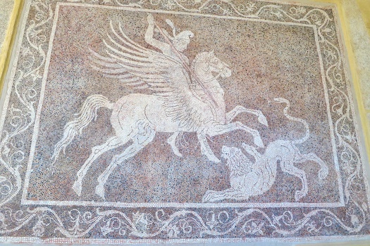 Mozaic of a horseman fighting a lion