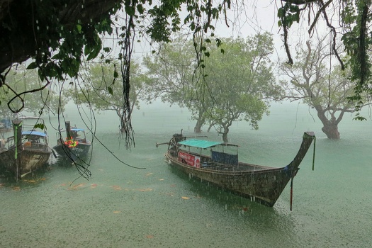 Raining longtail boat